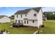 Exterior shot of the home's backyard with the deck and patio at 46 Blaze Ridge Dr, Smithfield, NC 27577