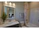 Full bathroom with shower-tub combo, modern vanity, and decorative accents at 4628 Rogers Rd, Wake Forest, NC 27587
