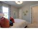 Bright bedroom with a large window and neutral décor for a serene living space at 4628 Rogers Rd, Wake Forest, NC 27587