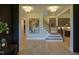 Elegant foyer with staircase, modern art, and bright lighting, leading to open living spaces at 4628 Rogers Rd, Wake Forest, NC 27587