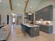 Spacious kitchen with a large island, stainless steel appliances and an adjacent staircase at 4628 Rogers Rd, Wake Forest, NC 27587