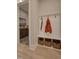 Organized mudroom with bench, storage baskets, and coat hooks for convenient entry at 4628 Rogers Rd, Wake Forest, NC 27587