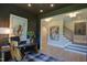 Stylish office space with a modern desk, dark accent walls, and ample natural light at 4628 Rogers Rd, Wake Forest, NC 27587