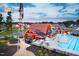 Stunning aerial view of community pool, clubhouse, and windmill amenity at 49 Cozy Hvn, Fuquay Varina, NC 27526