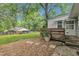 This home has a wooden deck and stepping stones in backyard at 5002 Kendridge Dr, Durham, NC 27712