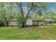 A spacious backyard and carport with a lush green lawn at 5002 Kendridge Dr, Durham, NC 27712