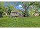 Picture of the green backyard and back of the house at 5002 Kendridge Dr, Durham, NC 27712