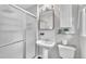 Clean bathroom featuring a tiled glass shower, pedestal sink, and classic fixtures at 5002 Kendridge Dr, Durham, NC 27712