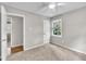 This bedroom features neutral walls, carpet, and a ceiling fan at 5002 Kendridge Dr, Durham, NC 27712