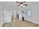 Bonus room with wood floors, ceiling fan, french doors to another room, and an exterior door at 5002 Kendridge Dr, Durham, NC 27712
