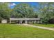 Single story home with large yard, convenient carport, and an additional storage shed at 5002 Kendridge Dr, Durham, NC 27712