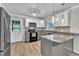 Modern kitchen with island, granite counters, stainless appliances, and white and gray cabinets at 5002 Kendridge Dr, Durham, NC 27712