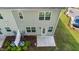 Backyard patio showcasing a sliding glass door and large windows, perfect for enjoying natural light at 501 Hazy Hills Ln, Garner, NC 27529
