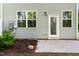 Back patio view of rear of home, including door and windows for a bright living space at 501 Hazy Hills Ln, Garner, NC 27529