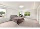 Bedroom with comfortable bed, tray ceilings, and a desk by a bright window at 501 Hazy Hills Ln, Garner, NC 27529