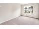 Bright bedroom with neutral carpet, and a window for plenty of natural light at 501 Hazy Hills Ln, Garner, NC 27529