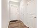 Bright entryway with a white front door, wood floors, and white trim at 501 Hazy Hills Ln, Garner, NC 27529