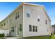 Exterior view featuring the backyard entrance, showcasing ample windows for natural lighting and easy access to the outdoors at 501 Hazy Hills Ln, Garner, NC 27529