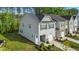 Aerial view of a gray two-story home with a one-car garage and green lawn at 501 Hazy Hills Ln, Garner, NC 27529