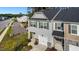 Aerial view of the gray two-story home with a one-car garage and a parking area at 501 Hazy Hills Ln, Garner, NC 27529