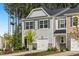 Charming exterior highlighting a two-car garage and manicured landscaping creating a welcoming curb appeal at 501 Hazy Hills Ln, Garner, NC 27529