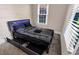 Comfortable bedroom featuring a stylish bed, storage, soft carpet, and natural light at 507 S Mebane St, Burlington, NC 27215