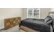 Comfortable bedroom with large window and stylish cabinet at 507 S Mebane St, Burlington, NC 27215