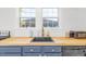 Kitchen featuring butcher block countertops, blue cabinetry, and stainless steel appliances at 507 S Mebane St, Burlington, NC 27215