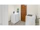 Bright laundry room with a full-size washer, dryer, and practical design at 507 S Mebane St, Burlington, NC 27215