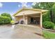 Carport featuring ample covered space with a brick wall, offering protection and convenience at 5932 Johnson Pond Rd, Fuquay Varina, NC 27526