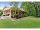 The home features a carport, covered patio and well-kept landscaping, for seamless indoor-outdoor living at 5932 Johnson Pond Rd, Fuquay Varina, NC 27526