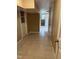 Spacious hallway with tile floors and white doors at 5932 Johnson Pond Rd, Fuquay Varina, NC 27526
