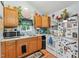 Bright kitchen with wooden cabinets, white appliances, and a large window at 5932 Johnson Pond Rd, Fuquay Varina, NC 27526