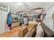Comfortable living room with a couch, mounted TV, and hardwood floors at 5932 Johnson Pond Rd, Fuquay Varina, NC 27526