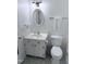 Small bathroom featuring a toilet, sink, vanity and classic tiled floor at 609 Malone Ct, Burlington, NC 27215