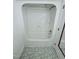 Bathroom showcasing a clean white shower/tub combo and patterned floor at 609 Malone Ct, Burlington, NC 27215