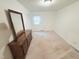 Bedroom featuring neutral carpet, a dresser with mirror, and a closet at 609 Malone Ct, Burlington, NC 27215