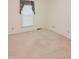 Bedroom with neutral carpet and window with patterned valance at 609 Malone Ct, Burlington, NC 27215