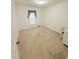 Bedroom featuring neutral carpet and a small window with curtains at 609 Malone Ct, Burlington, NC 27215