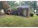 Back exterior of brick house with covered patio and air conditioning units at 609 Malone Ct, Burlington, NC 27215