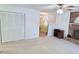 Cozy living area with fireplace and access to the dining room and closets at 609 Malone Ct, Burlington, NC 27215