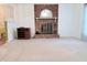 Spacious living room with brick fireplace and neutral carpet at 609 Malone Ct, Burlington, NC 27215