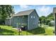 Backyard showing a home with blue siding and fenced in back yard at 635 Black Angus Dr, Haw River, NC 27258