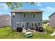 Spacious backyard with a blue siding, patio, seating, and slide at 635 Black Angus Dr, Haw River, NC 27258
