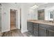 Bathroom features a double vanity, granite countertops, and a large walk-in closet at 635 Black Angus Dr, Haw River, NC 27258