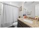 Neutral bathroom with granite countertop and tub shower with curtain at 635 Black Angus Dr, Haw River, NC 27258