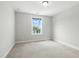 A bright bedroom with a window offering an outside view at 635 Black Angus Dr, Haw River, NC 27258