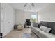 Neutral bedroom with a gray couch, desk, carpeted floors, and a ceiling fan at 635 Black Angus Dr, Haw River, NC 27258