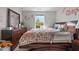 Comfortable bedroom with warm lighting, wooden furniture, and decorative touches at 635 Black Angus Dr, Haw River, NC 27258