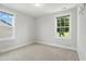 An airy bedroom featuring two windows to let the natural light in at 635 Black Angus Dr, Haw River, NC 27258